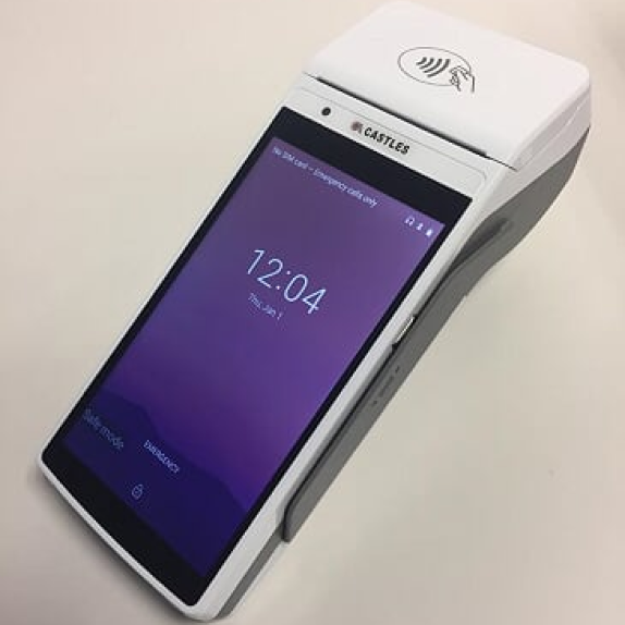 A payment terminal device with a screen displaying 12:04